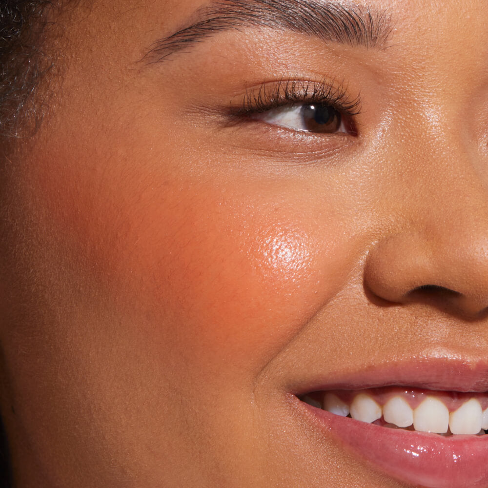 Golden Hour [A close up of a model with Tower 28 Beauty's BeachPlease Cream Blush in Golden Hour on her face.]
