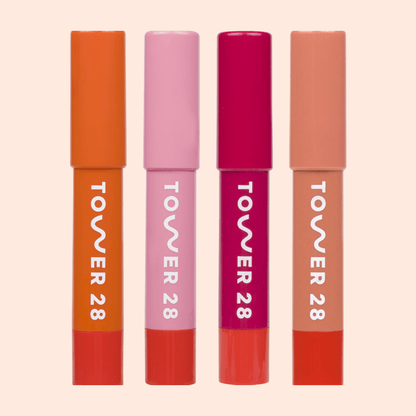 JuiceBalm Lip Balm Set [Shared: A close up of all four shades in Tower 28 Beauty's JuiceBalm Set: Drink, Shake, Mix, and Squeeze.]