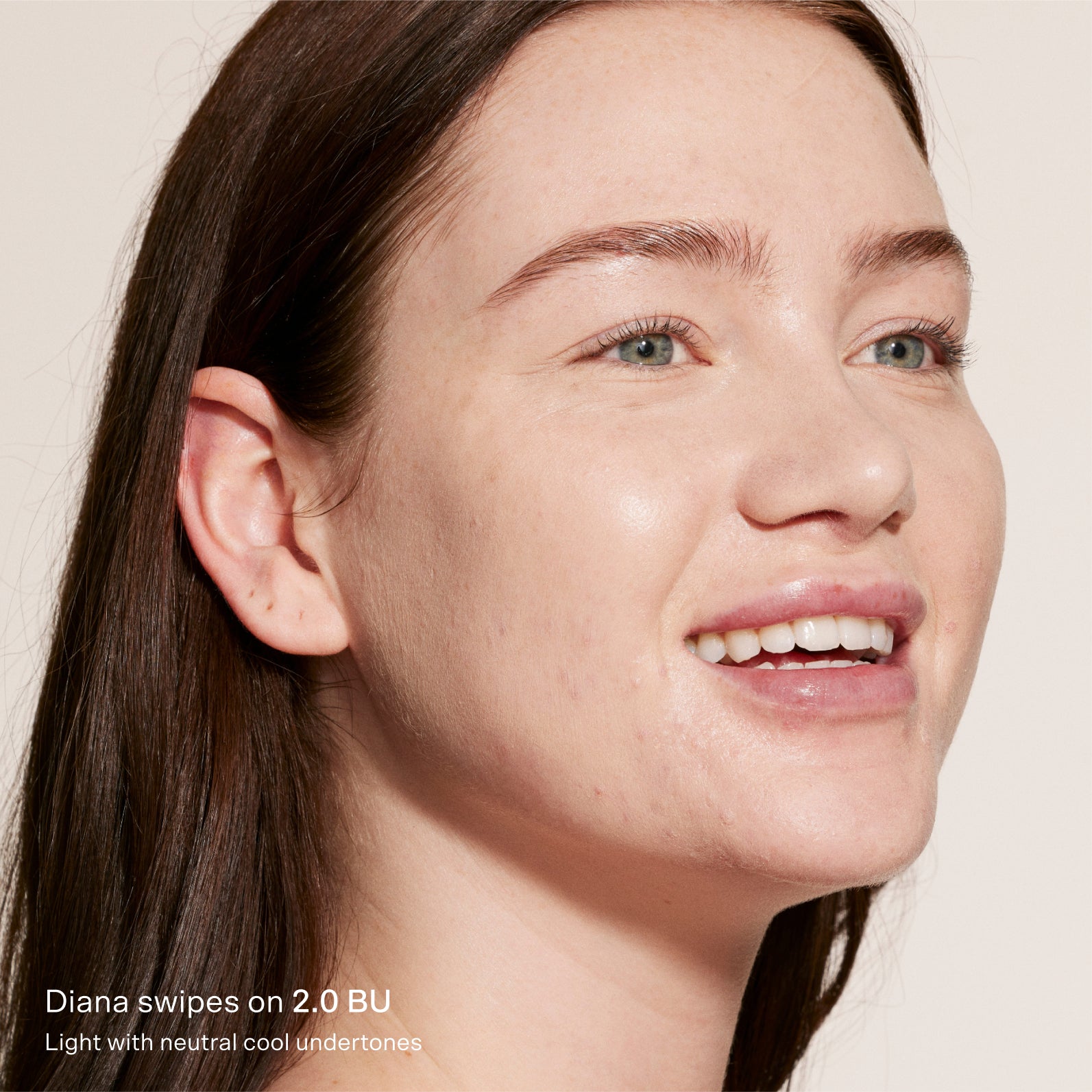 Close-up of a woman's face with text indicating product application on skin.  [2.0 BU]