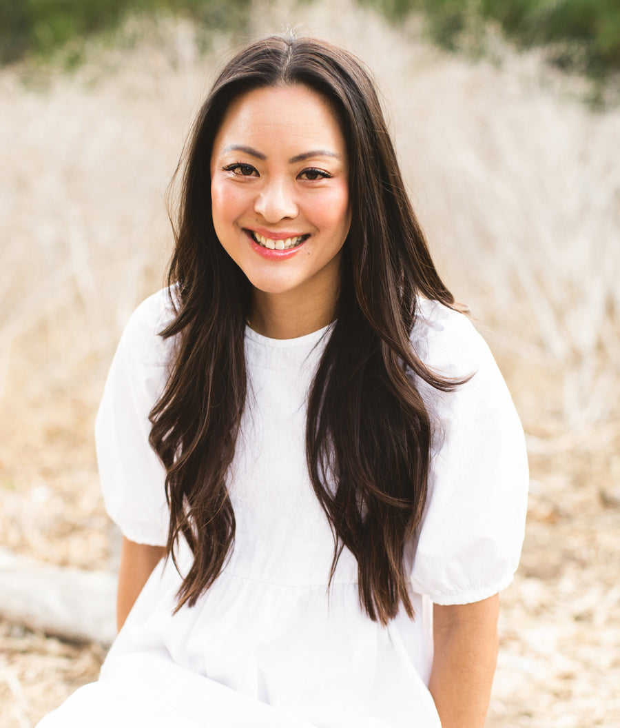 [A photo of Amy Liu, founder and CEO of Tower 28 Beauty, outdoors in natural lighting.] 