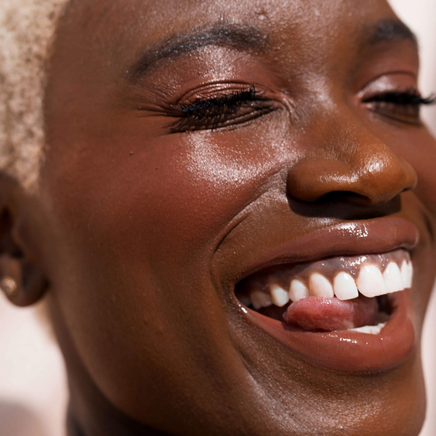 Power Hour [A close up of a model with Tower 28 Beauty's BeachPlease Cream Blush in Power Hour on her face.]