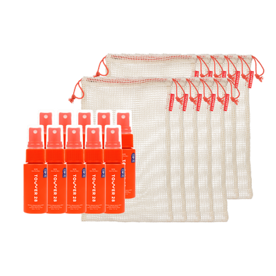 Set of orange spray bottles with a mesh bag on a white background [Shared]