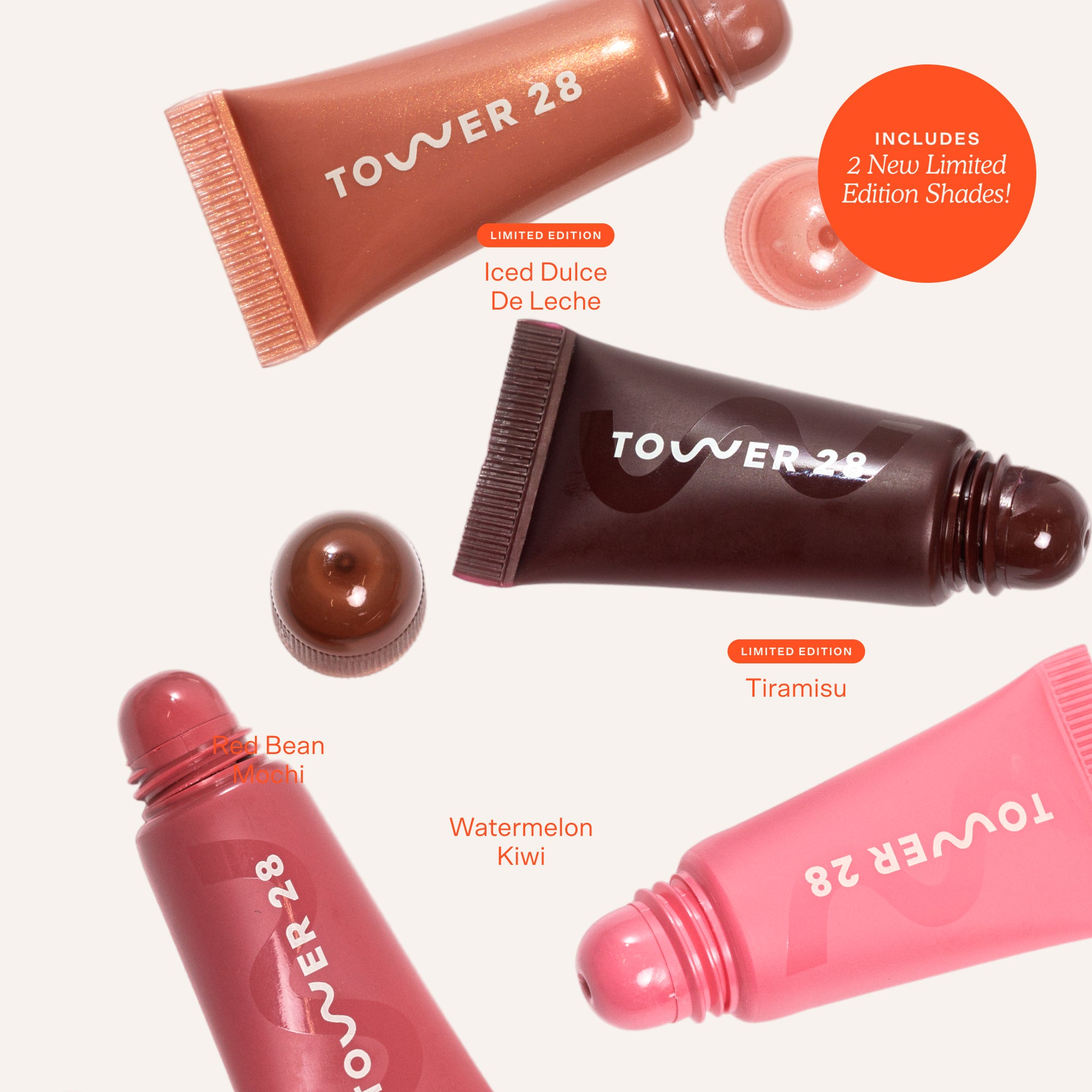 Four lip gloss tubes from Tower 28 with different colors and flavors on a white background. [Lil’ Softies Lip Treatment Set]