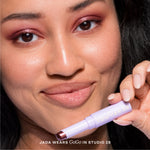 [Close-up of a woman applying Tower 28 GoGo Eyeshadow. Studio 28 + Chateau]