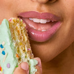 Tower 28 Beauty's LipSoftie™ Lip Treatment in Confetti Cake applied on three different skin tones. [Confetti Cake]