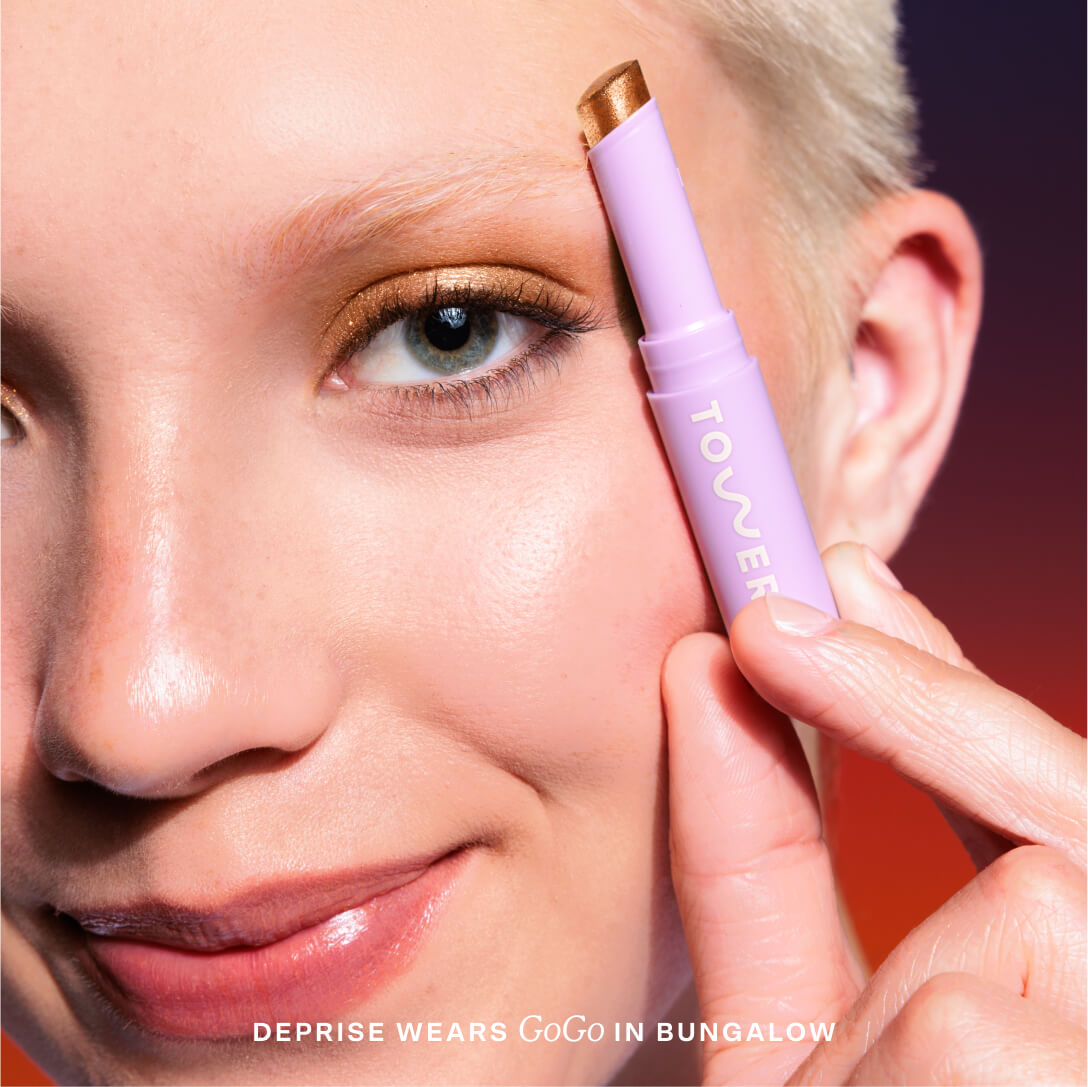 Close-up of a woman applying makeup [Bungalow]