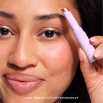 Close-up of a woman applying makeup [Troubadour]