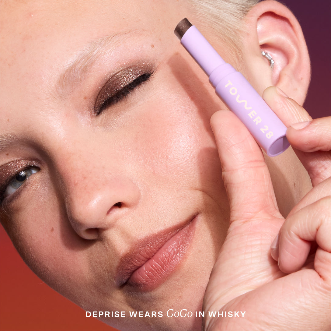 [Close-up of a person applying makeup  featuring the brand 'Tower 28' on the product. Avalon + Whisky]