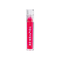 A model wearing the Tower 28 Beauty ShineOn Lip Jelly in the shade Iced XOXO. [Iced XOXO]