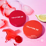 Two red compacts with 'Tower 28' branding on a pink background with ice and a cherry. [Shared]