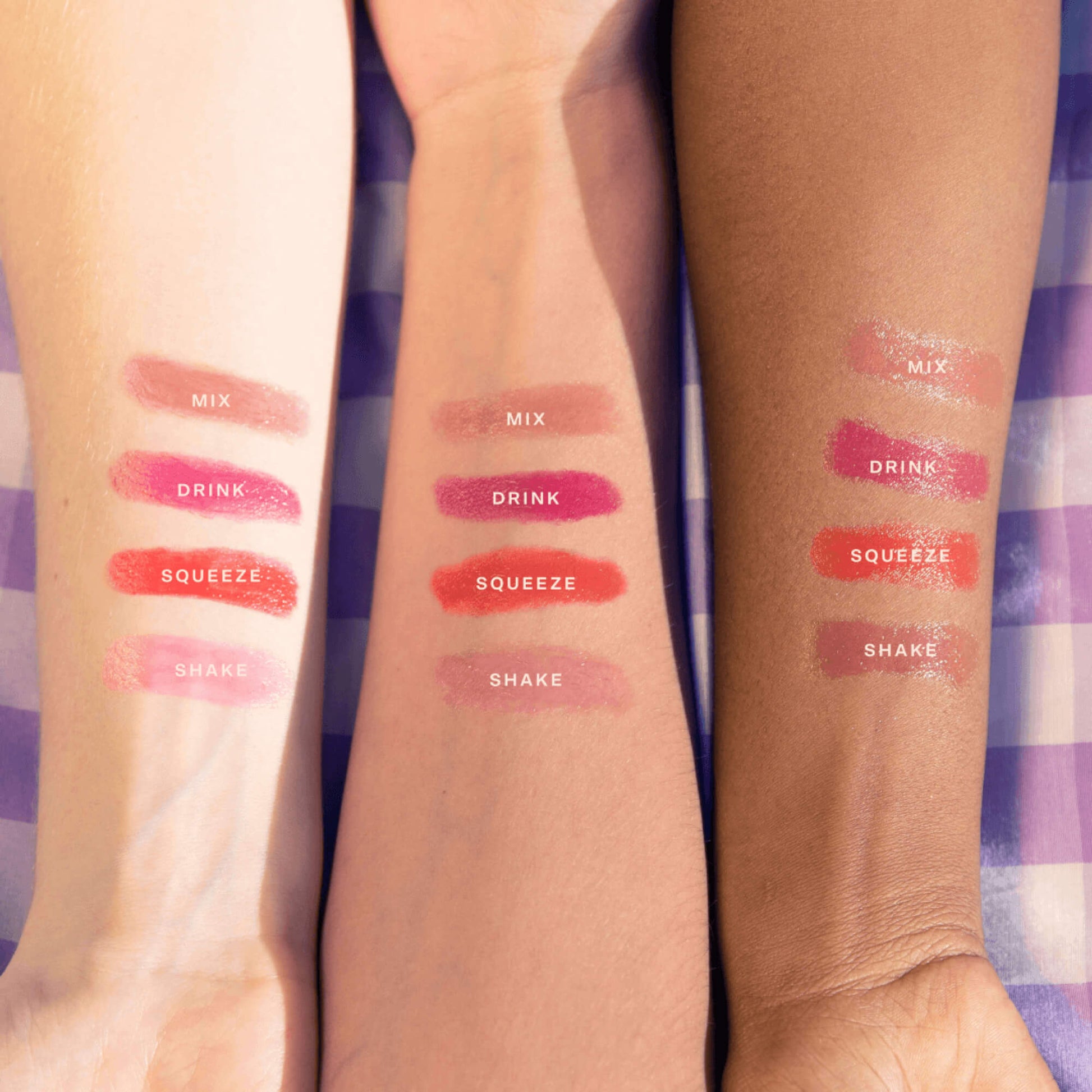 Shared: All shades of Tower 28 Beauty's JuiceBalm swatched on three models with different skin tones (Drink, Shake, Mix, and Squeeze).