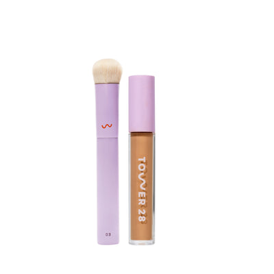 [shared] Tower 28 makeup set featuring a lavender lip gloss tube with a beige formula visible inside and a matching lavender makeup brush with cream bristles, shown on a solid white background.