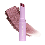 Eyeshadow with glittery texture and 'Tower 28' branding on a white background [Studio 28]
