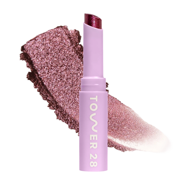 Eyeshadow with glittery texture and 'Tower 28' branding on a white background [Studio 28]