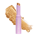 Eyeshadow with glittery texture and 'Tower 28' branding on a white background [Bungalow]