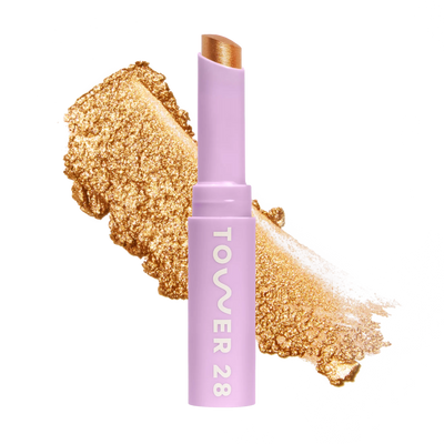 Eyeshadow with glittery texture and 'Tower 28' branding on a white background [Bungalow]