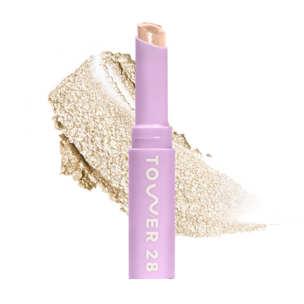Eyeshadow with glittery texture and 'Tower 28' branding on a white background [Chateau]
