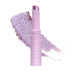 Eyeshadow with glittery texture and 'Tower 28' branding on a white background [Garden]