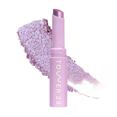 Eyeshadow with glittery texture and 'Tower 28' branding on a white background [Garden]