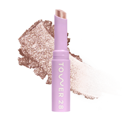 Eyeshadow with glittery texture and 'Tower 28' branding on a white background [Roxy]
