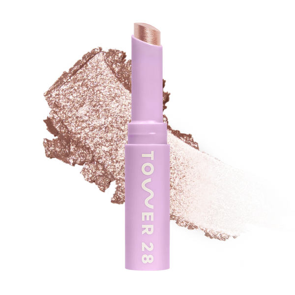 Eyeshadow with glittery texture and 'Tower 28' branding on a white background [Roxy]