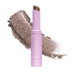 Eyeshadow with glittery texture and 'Tower 28' branding on a white background [Whisky]