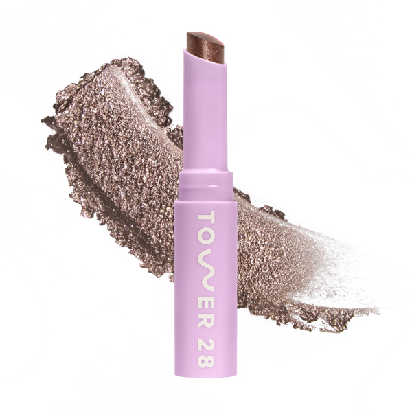 Eyeshadow with glittery texture and 'Tower 28' branding on a white background [Whisky]