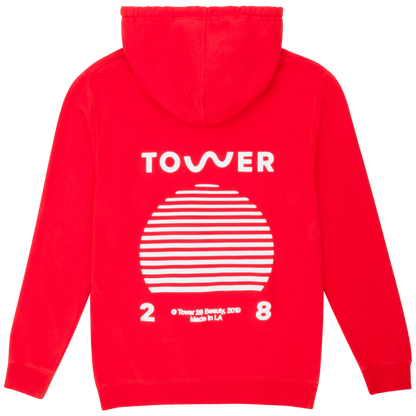[Shared: A flat lay image of Tower 28 Beauty's SOS Hoodie in sunset orange where all proceeds are donated to Heal The Bay.]