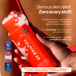 Red bottle of Tower 28 body wash with text about skin relief and product  features. [Shared]
