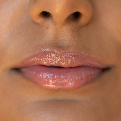 Pistachio [A model wearing the Tower 28 Beauty ShineOn Lip Jelly in the shade Pistachio on her lips]