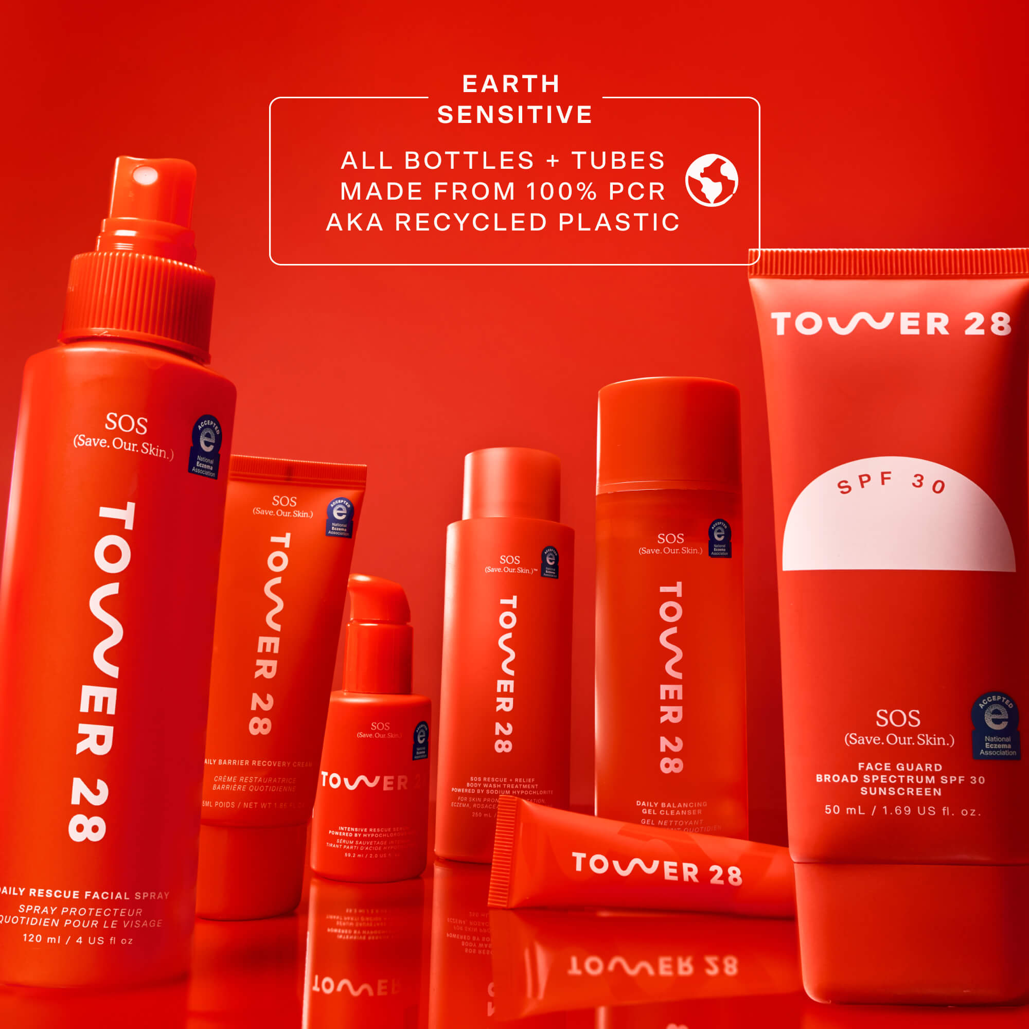 Collection of Tower 28 skincare products on a red background [Shared]