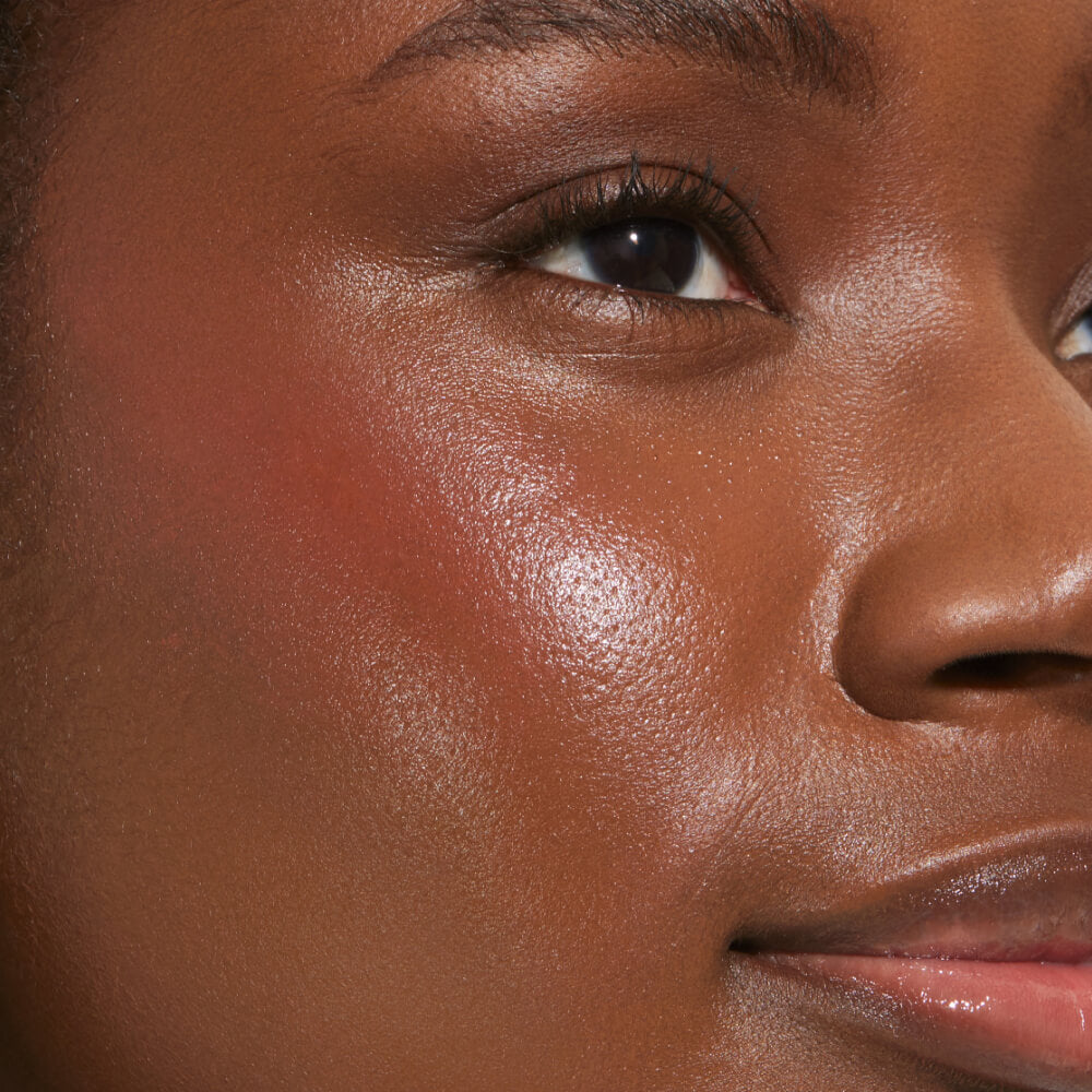 Power Hour [A close up of a model with Tower 28 Beauty's BeachPlease Cream Blush in Power Hour on her face.]