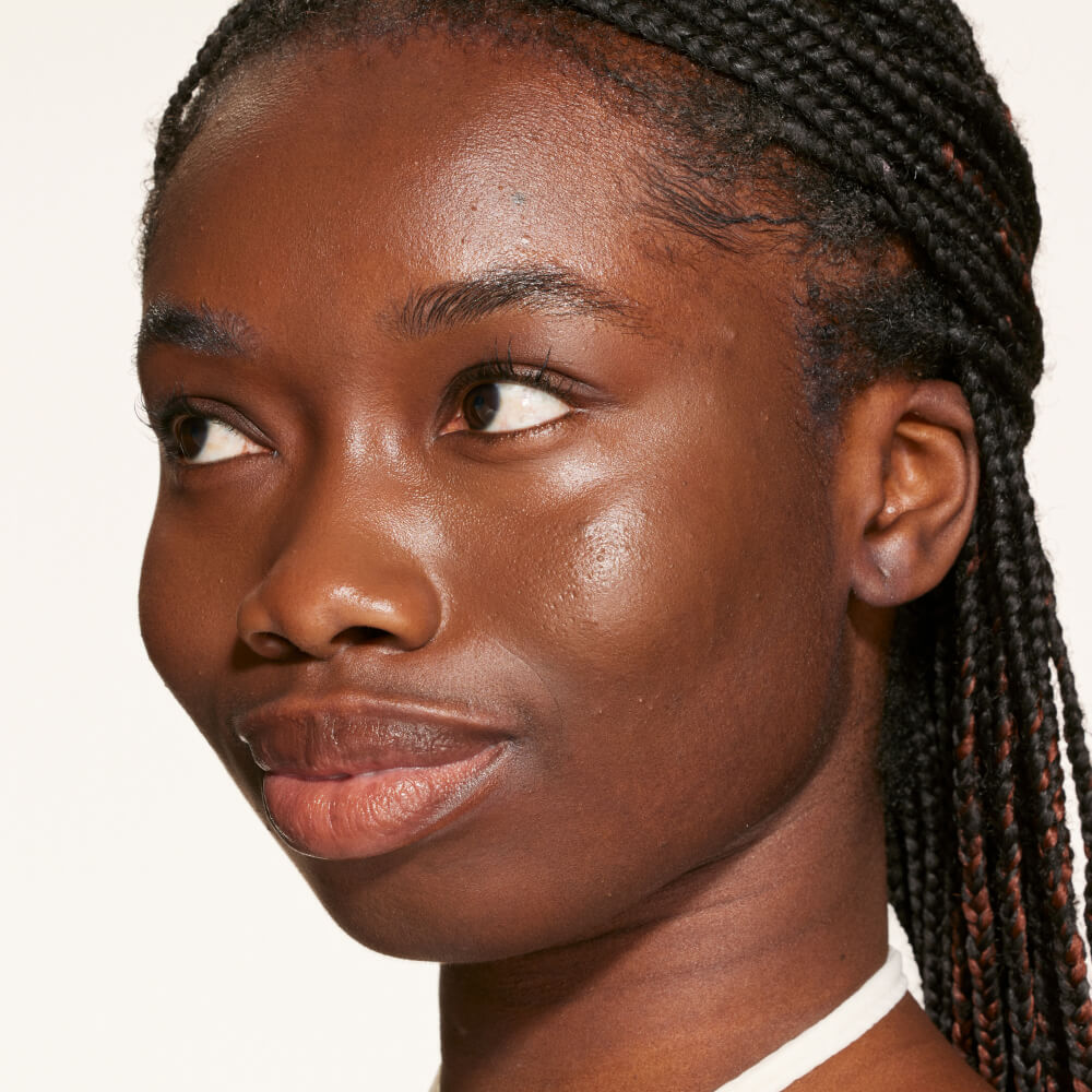 A person's face with an evened out complexion after using Tower 28 Beauty's Swipe Serum Concealer in shade 20.0 WLA. [20.0 WLA]