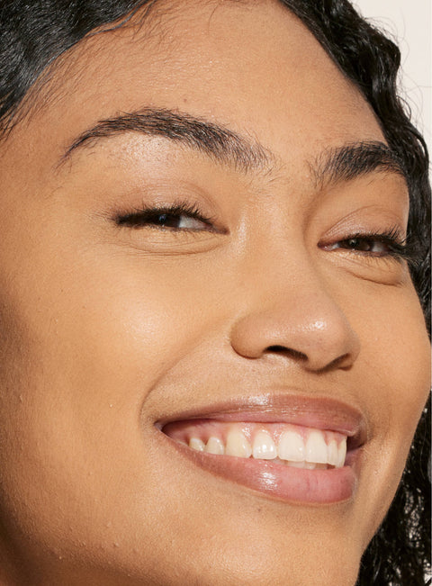 [A person's face with an evened out complexion after using Tower 28 Beauty's Swipe Serum Concealer in shade 11.]