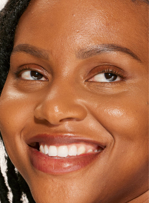 [A person's face with an evened out complexion after using Tower 28 Beauty's Swipe Serum Concealer in shade 16.]