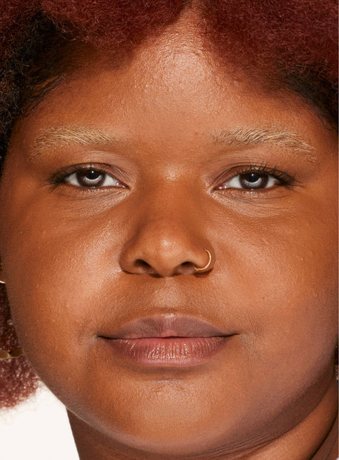 [A person's face with an evened out complexion after using Tower 28 Beauty's Swipe Serum Concealer in shade 17.]