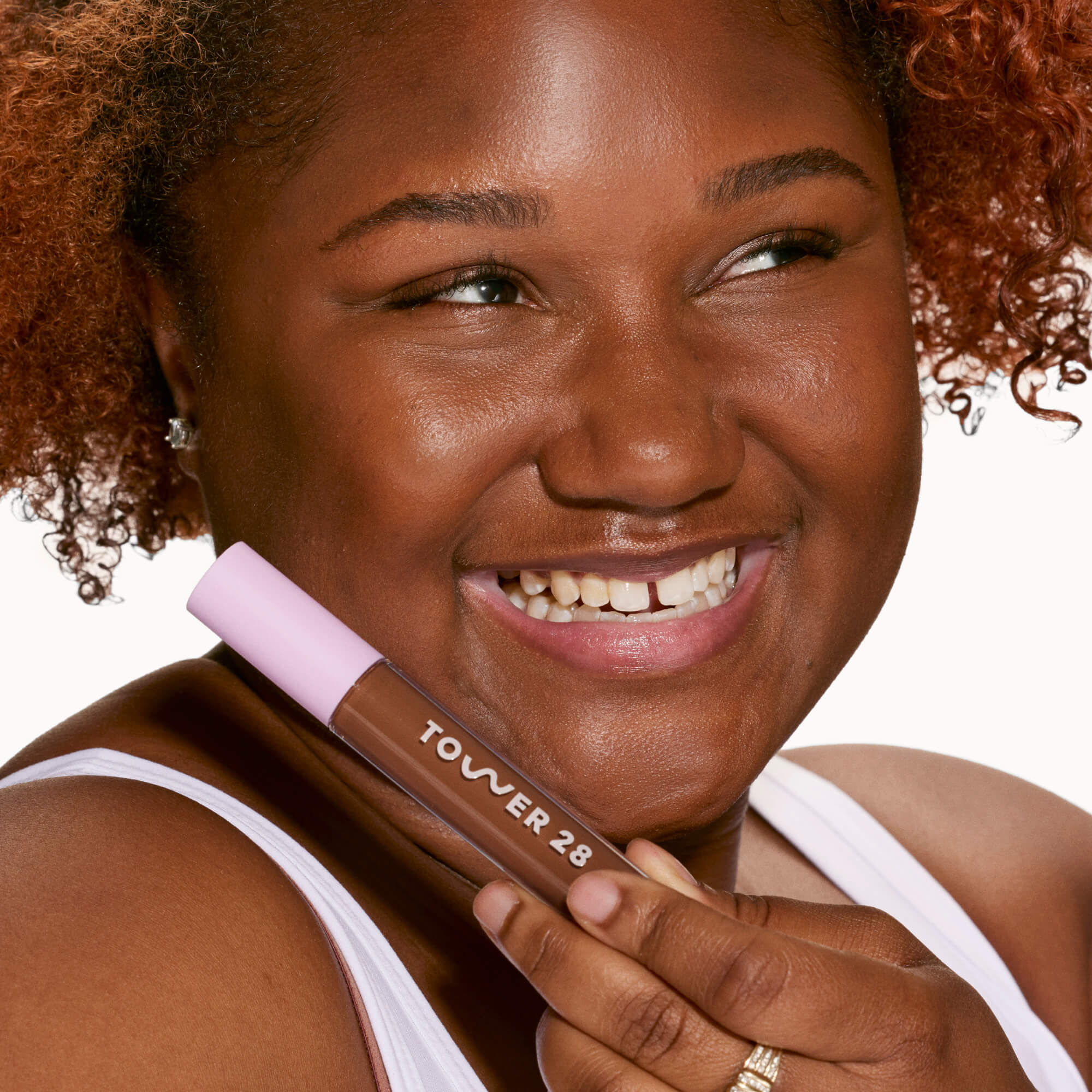 A person's face with an evened out complexion after using Tower 28 Beauty's Swipe Serum Concealer in shade 19.0 WEHO. [19.0 WEHO]
