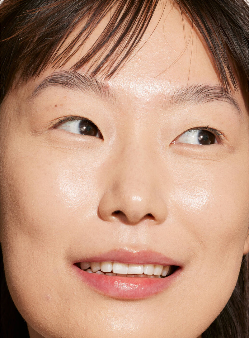 [A person's face with an evened out complexion after using Tower 28 Beauty's Swipe Serum Concealer in shade 4.0]