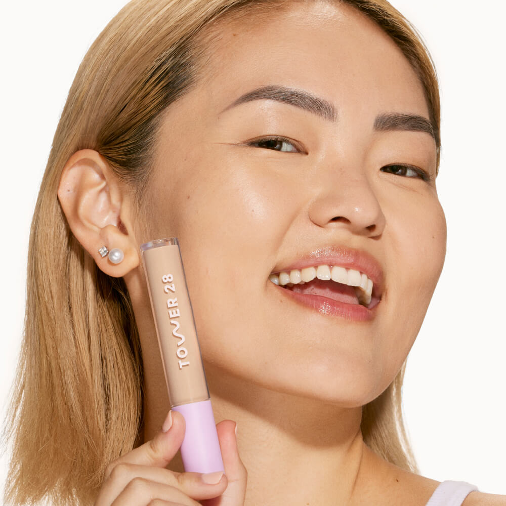 6.0 IE [A person's face with an evened out complexion after using Tower 28 Beauty's Swipe Serum Concealer in shade 6.0 IE]