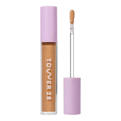 Tower 28 Beauty Swipe Serum Concealer in the shade 12.0 PALI, shown with the tube standing upright next to the open applicator wand to reveal the product. [12.0 PALI]