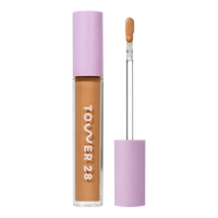 Tower 28 Beauty Swipe Serum Concealer in the shade 13.0 PLAYA, shown with the tube standing upright next to the open applicator wand to reveal the product. [13.0 PLAYA]