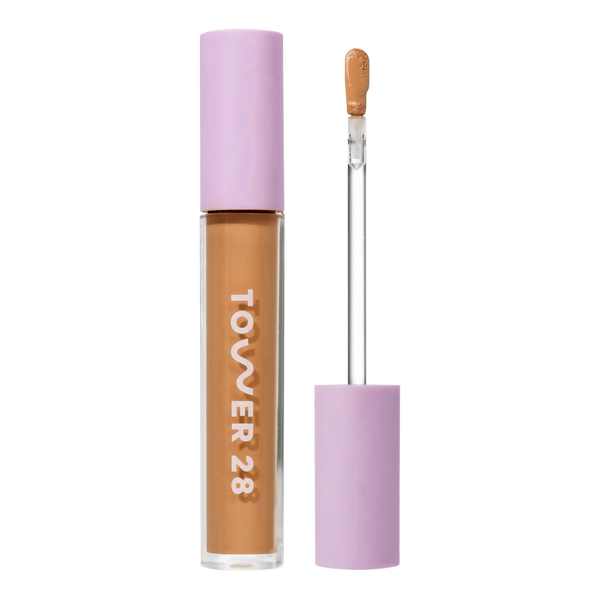 Tower 28 Beauty Swipe Serum Concealer in the shade 13.0 PLAYA, shown with the tube standing upright next to the open applicator wand to reveal the product. [13.0 PLAYA]