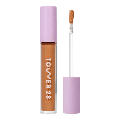 Tower 28 Beauty Swipe Serum Concealer in the shade 14.0 PV, shown with the tube standing upright next to the open applicator wand to reveal the product. [14.0 PV]