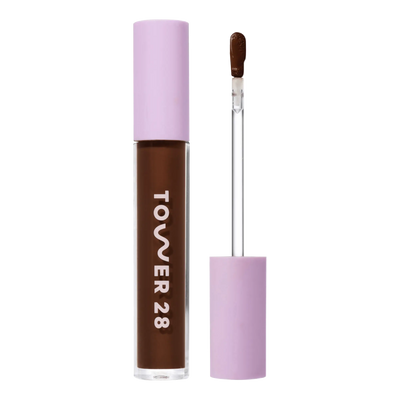 Tower 28 Beauty Swipe Serum Concealer in the shade 20.0 WLA, shown with the tube standing upright next to the open applicator wand to reveal the product. [20.0 WLA]