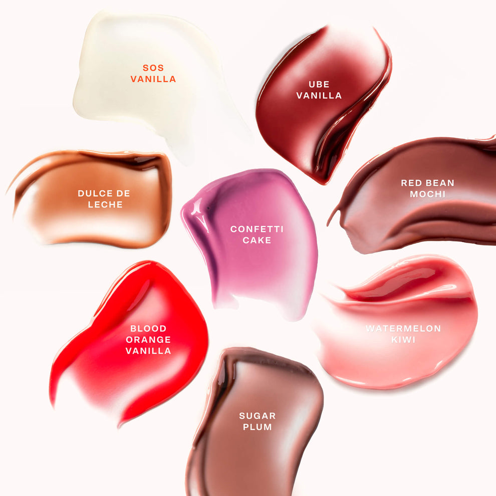 [Shared: Image displaying swatches of all LipSoftie shades, applied in smooth, glossy strokes on skin or a neutral background. Each swatch shows the distinct color and finish of the product, ranging from sheer tints to more pigmented hues. The visual highlights the variety of flavors and shades available in the LipSoftie collection.