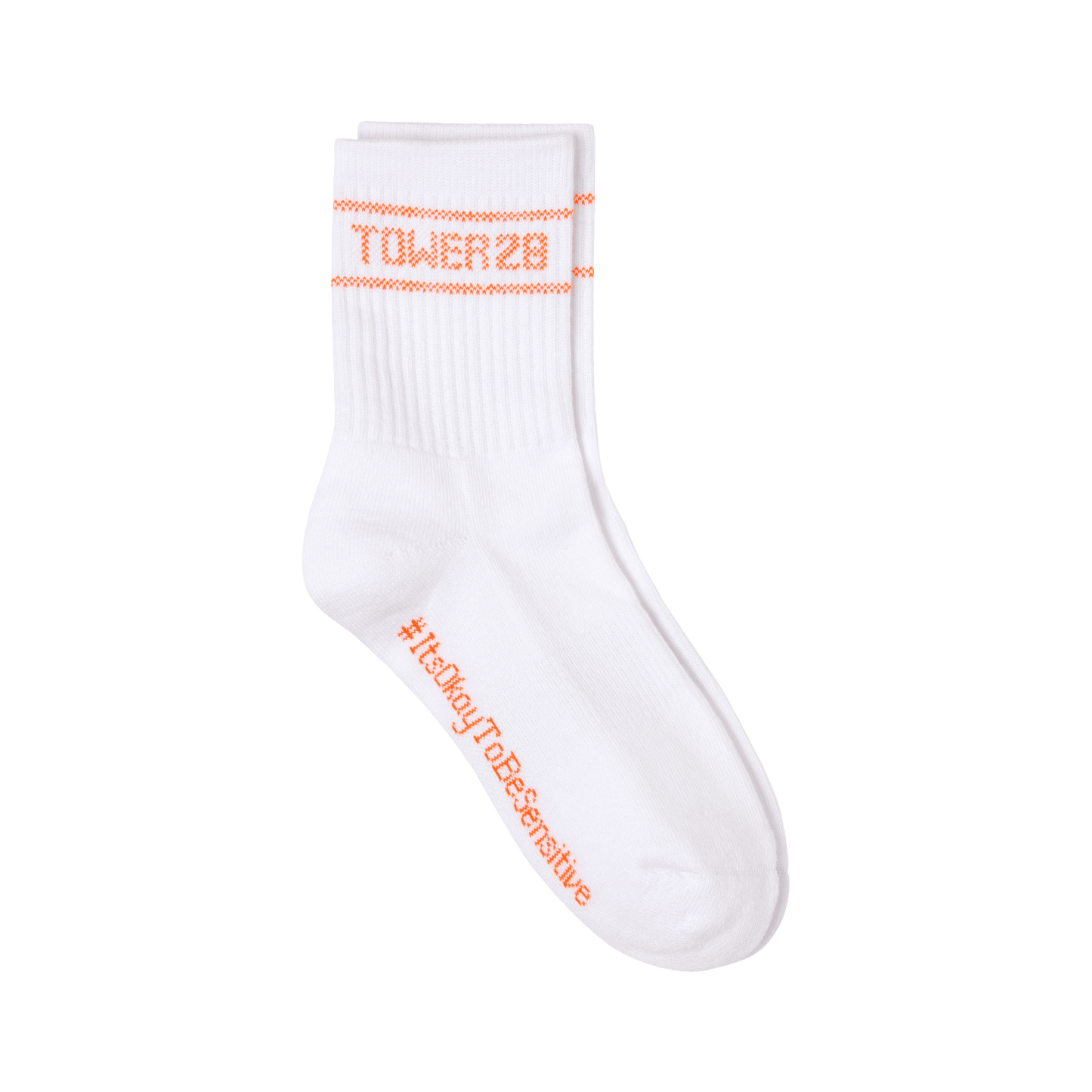 [Shared: A pair of Tower 28 Beauty's white crew socks designed with orange cross stiching that says "Tower 28" and "#ItsOkayToBeSensitive"]