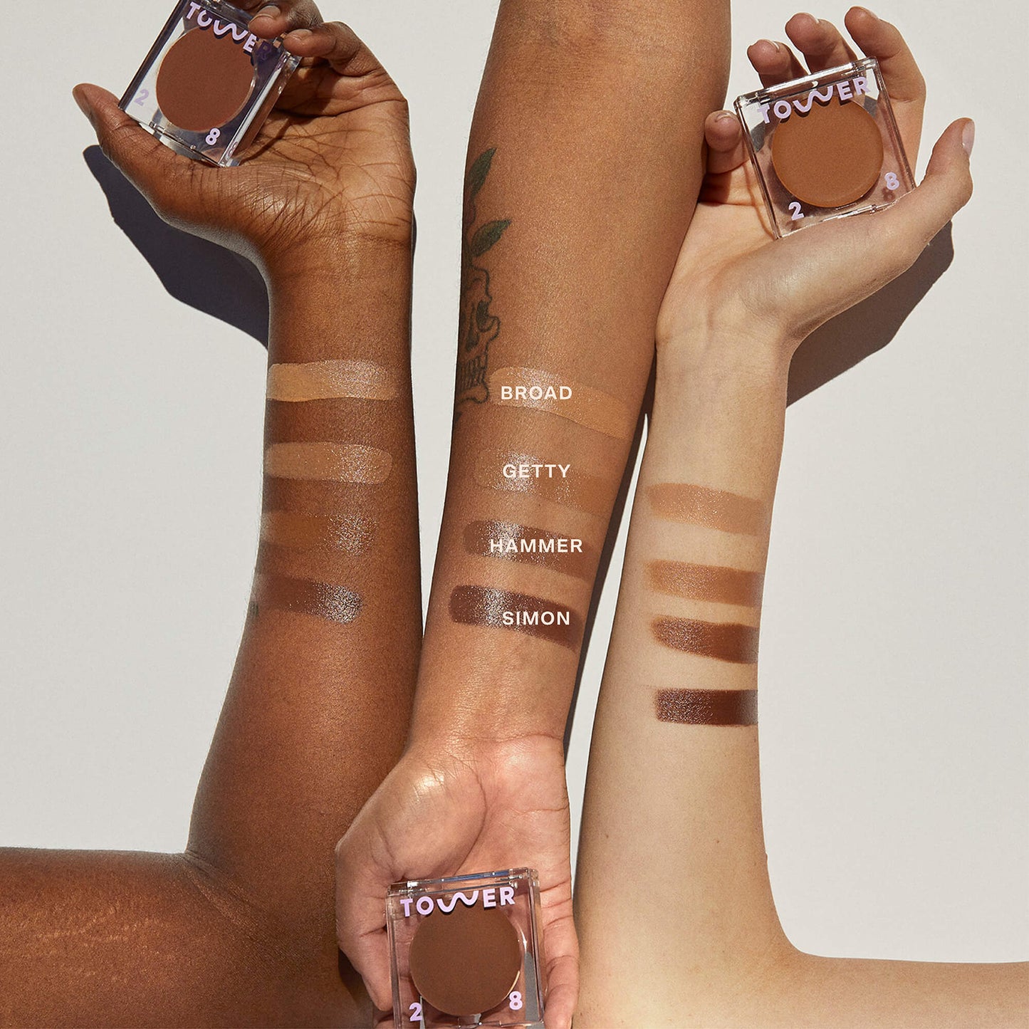 [Shared: All four shades of the Tower 28 Beauty Sculptino™ Cream Contour swatched on three different skin tones]