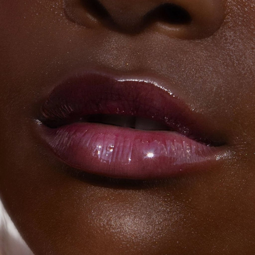 Shade: Fear Less [A model wearing the Tower 28 Beauty ShineOn Lip Jelly in the shade Fear Less on her lips]