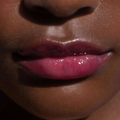 XOXO [A model wearing the Tower 28 Beauty ShineOn Lip Jelly in the shade XOXO on her lips]