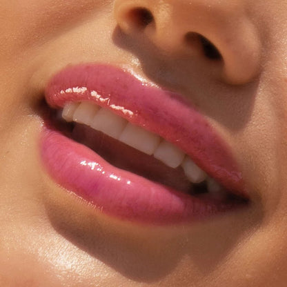 XOXO [A model wearing the Tower 28 Beauty ShineOn Lip Jelly in the shade XOXO on her lips]